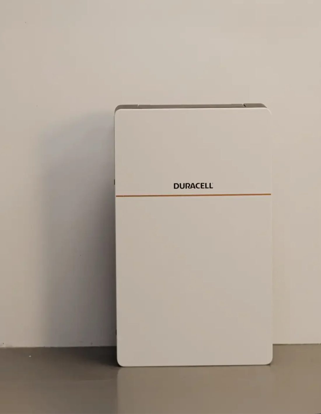 Duracell Energy home battery against a plain wall