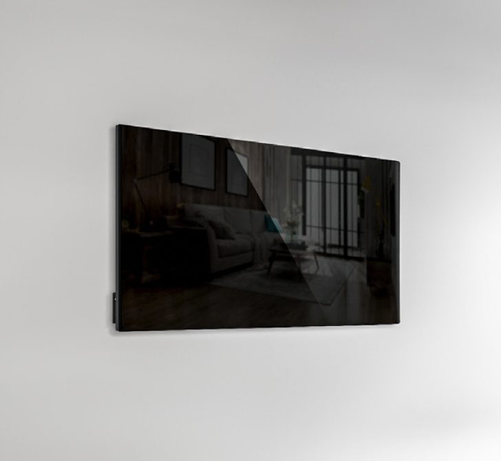 Black glass infrared heating panel on a living room wall