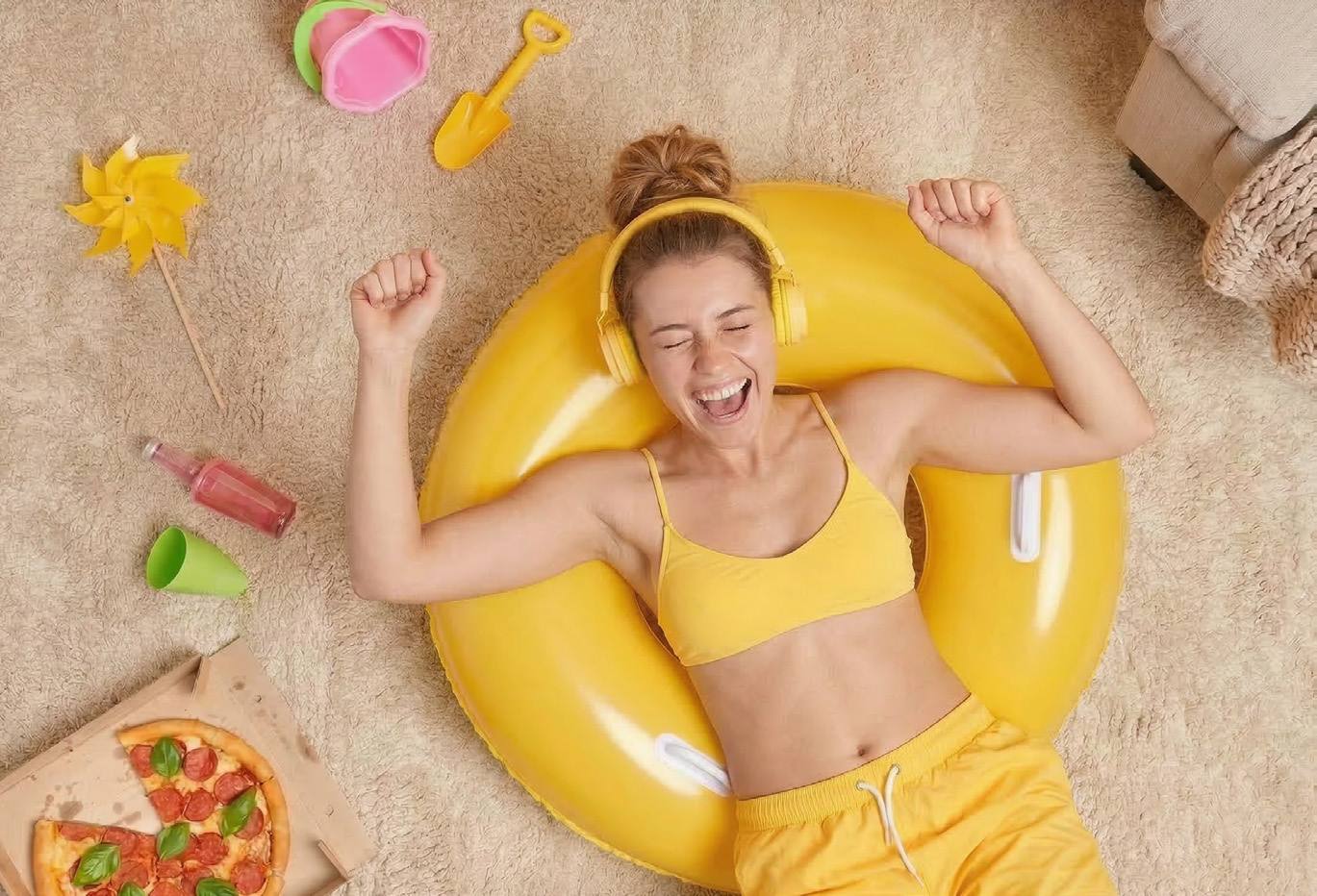 Woman lying on a warm floor in a swim ring